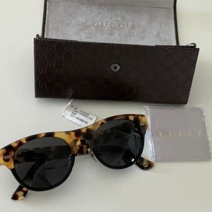 Gucci tortoise sunglasses with case and cleaning cloth.